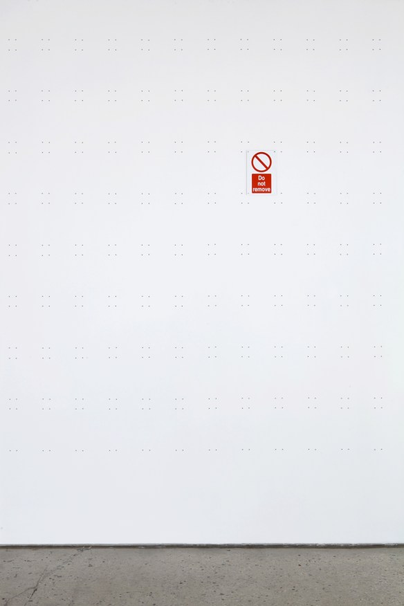 Wall plugs, readymade 'Do Not Remove' sign, wall